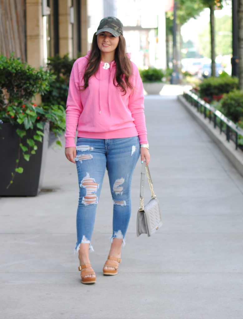 Pink hoodie and camouflage hat