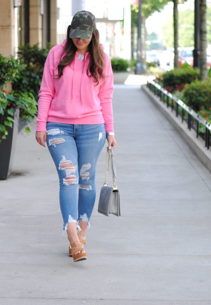 Pink hoodie and camouflage hat