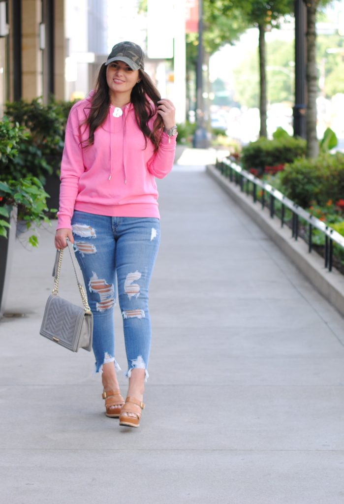 Pink hoodie and camouflage hat