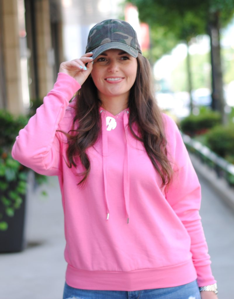 Pink hoodie and camouflage hat