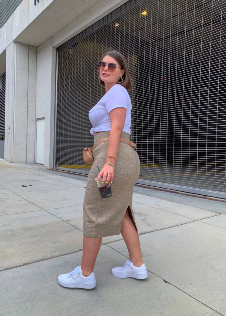 CHIC STREET STYLE OUTFIT: H&M SWEATER SKIRT, CALI PUMA SNEAKERS, BELT BAG. DETAILS HERE: http://www.juliamarieb.com/2019/09/03/fall-outfit:-knit-sweater-midi-skirt-and-cali-puma-sneakers/ @julia.marie.b