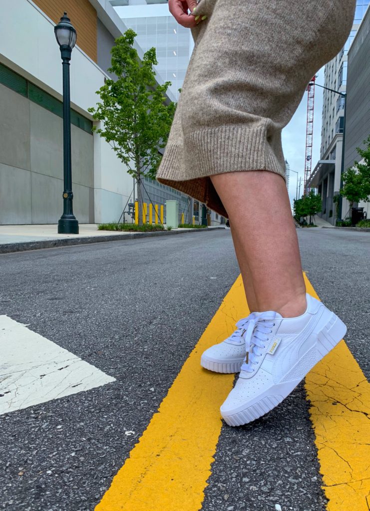 CHIC STREET STYLE OUTFIT: H&M SWEATER SKIRT, CALI PUMA SNEAKERS, BELT BAG. DETAILS HERE: http://www.juliamarieb.com/2019/09/03/fall-outfit:-knit-sweater-midi-skirt-and-cali-puma-sneakers/ @julia.marie.b