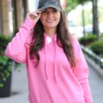 Pink hoodie and camouflage hat